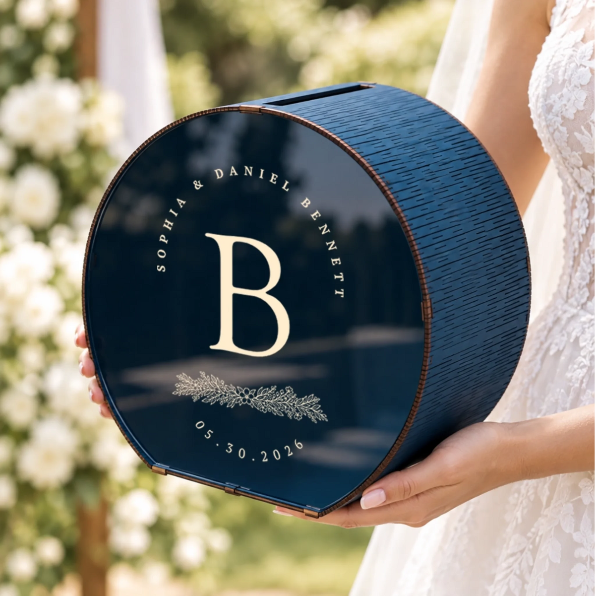 Close-up of personalized navy monogram wedding card box with custom initial and wedding details